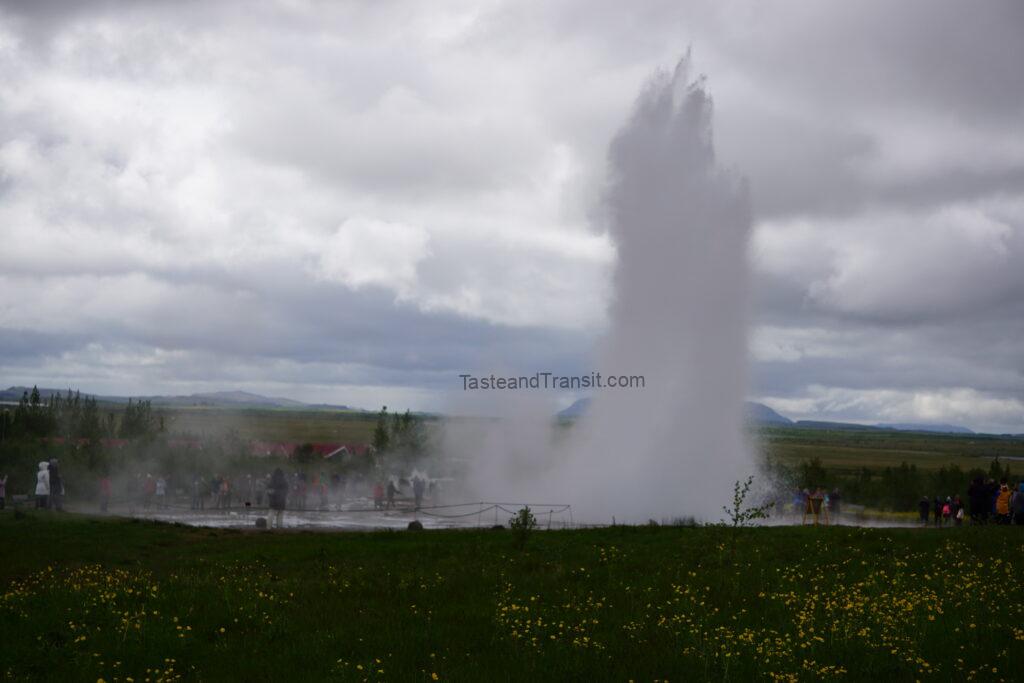 Strokkur geysir erupting a column of water into the sky in Iceland