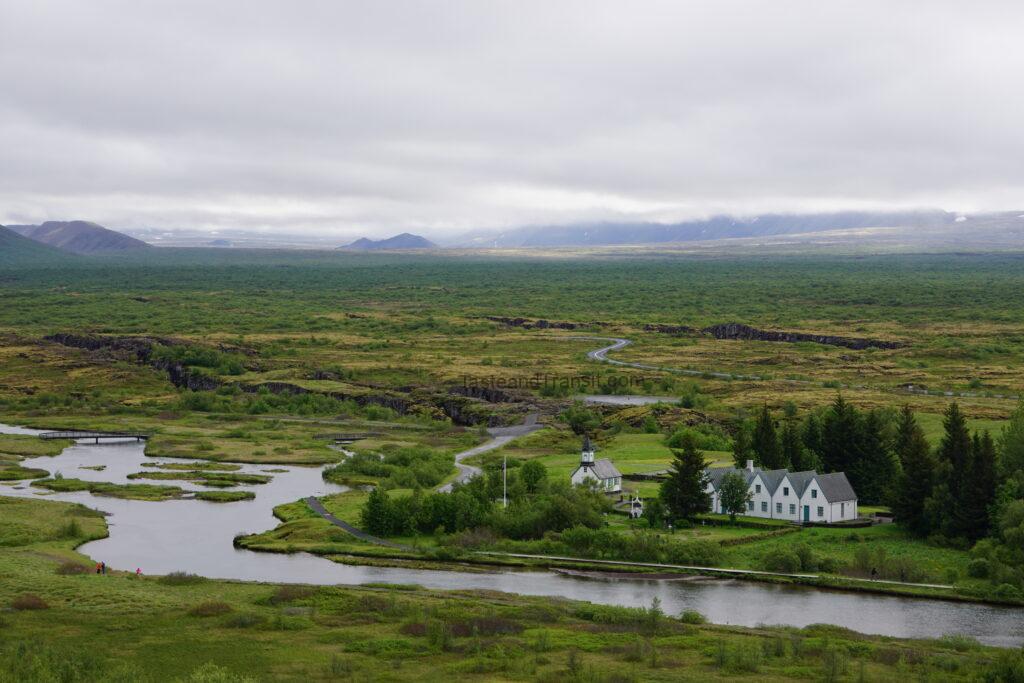 Green grassy landscape and rift valley in Pingvellir National Park Iceland