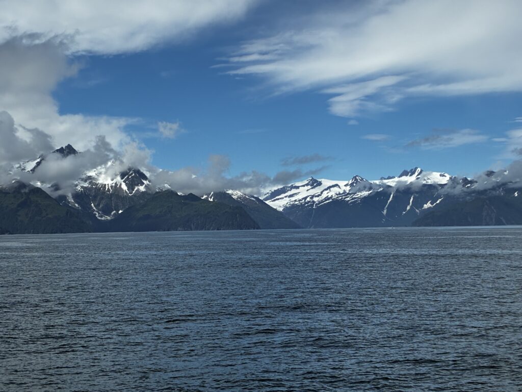 Glacial bay bordered by steep snowy mountain ridges, Kenai Fjords